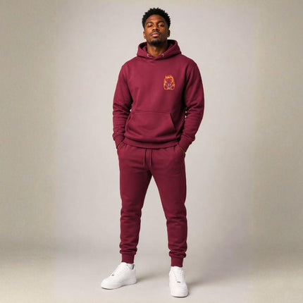 Maroon hoodie with pink retro typography reading ‘Whatever you’re not changing, you’re choosing’ – Roydel Graphic faith‑based streetwear”
