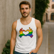 Man wearing a white tank top with rainbow hands forming a heart design outdoors.