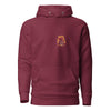 Maroon hoodie with pink retro typography reading ‘Whatever you’re not changing, you’re choosing’ – Roydel Graphic faith‑based streetwear”
