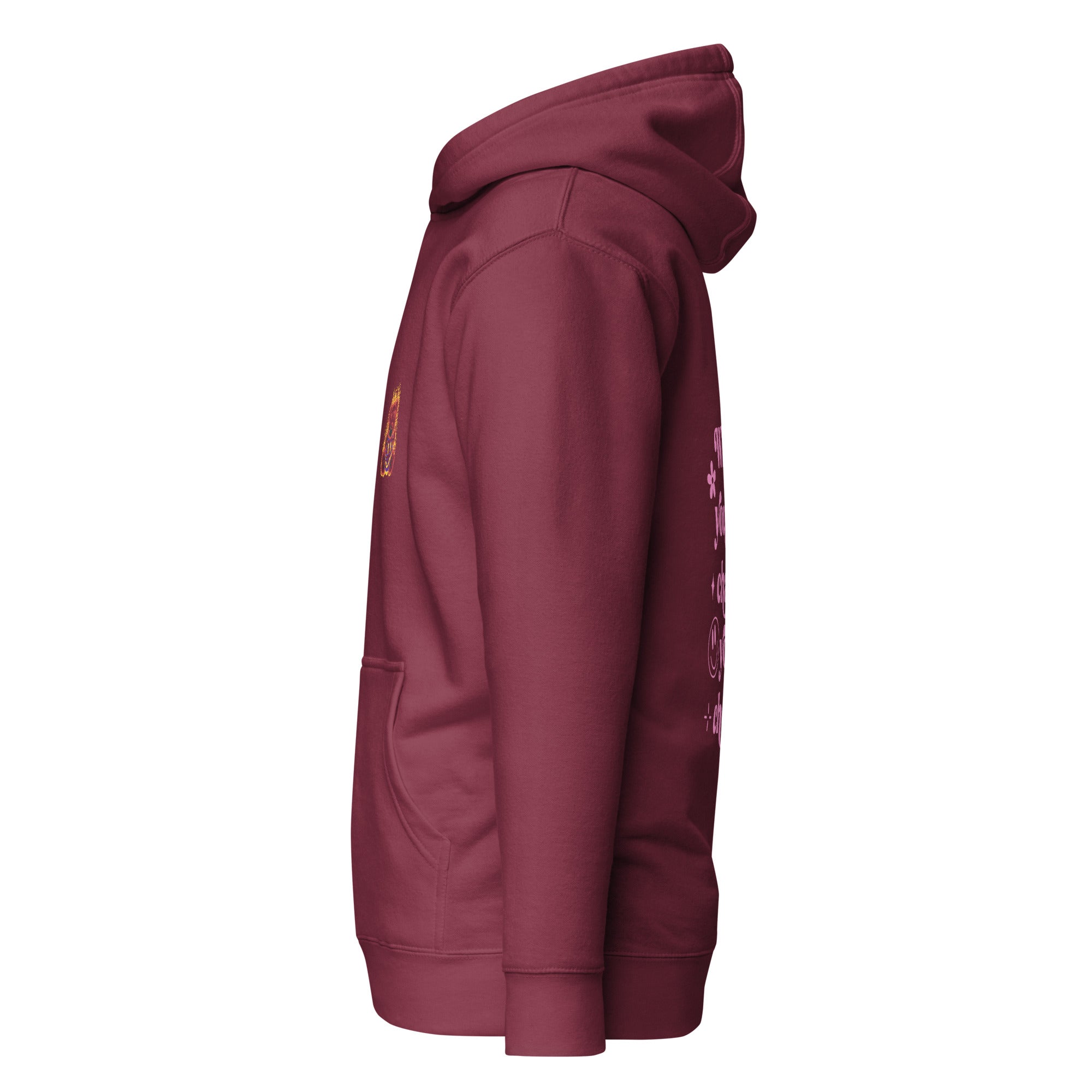 Maroon hoodie with pink retro typography reading ‘Whatever you’re not changing, you’re choosing’ – Roydel Graphic faith‑based streetwear”