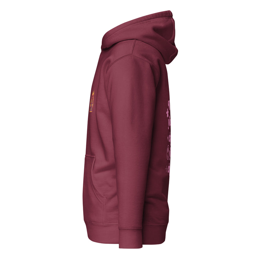 Maroon hoodie with pink retro typography reading ‘Whatever you’re not changing, you’re choosing’ – Roydel Graphic faith‑based streetwear”