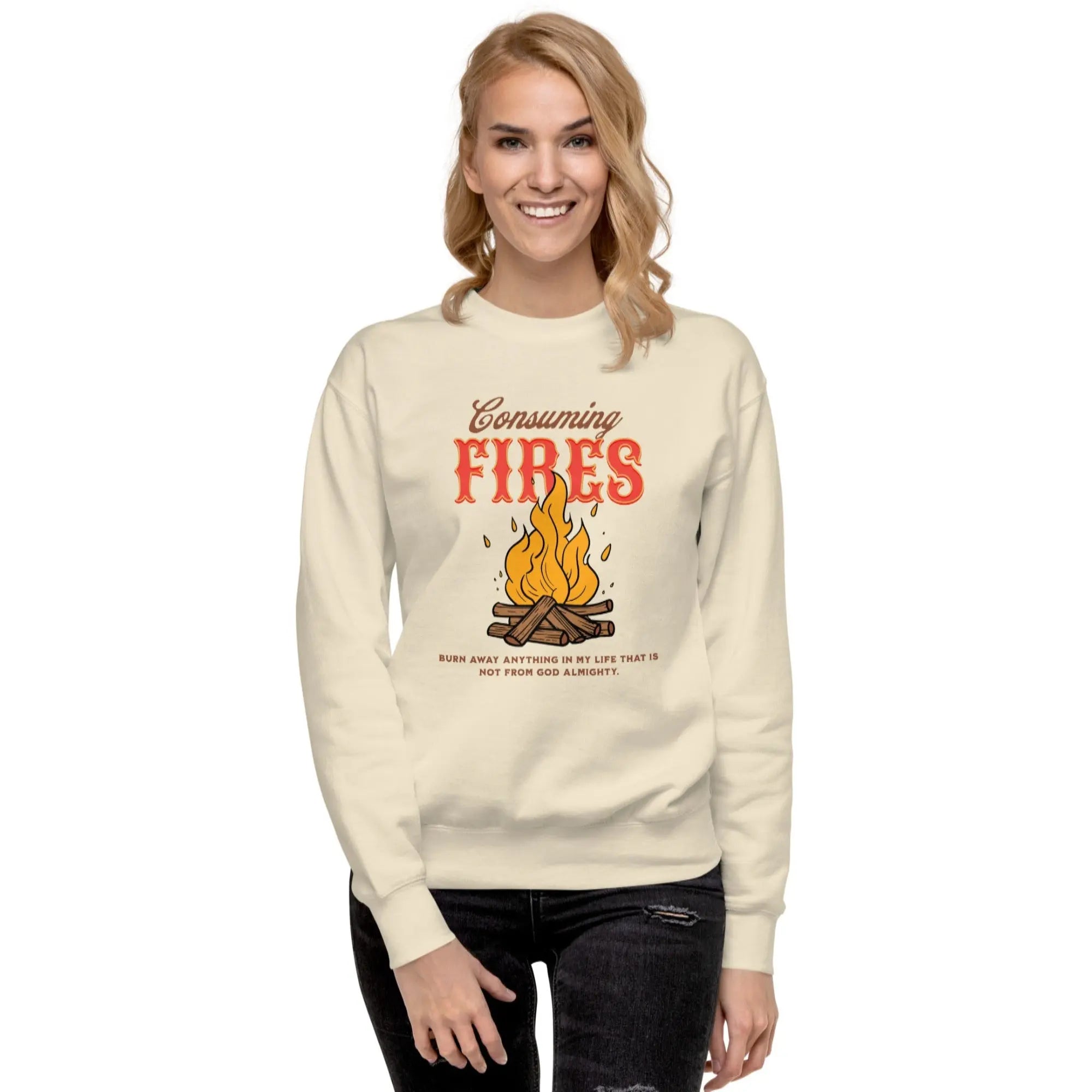 Person wearing a cream sweatshirt with 'Consuming Fires' text and graphic on a white background